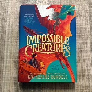 Impossible Creatures by Katherine Rundell with red edges